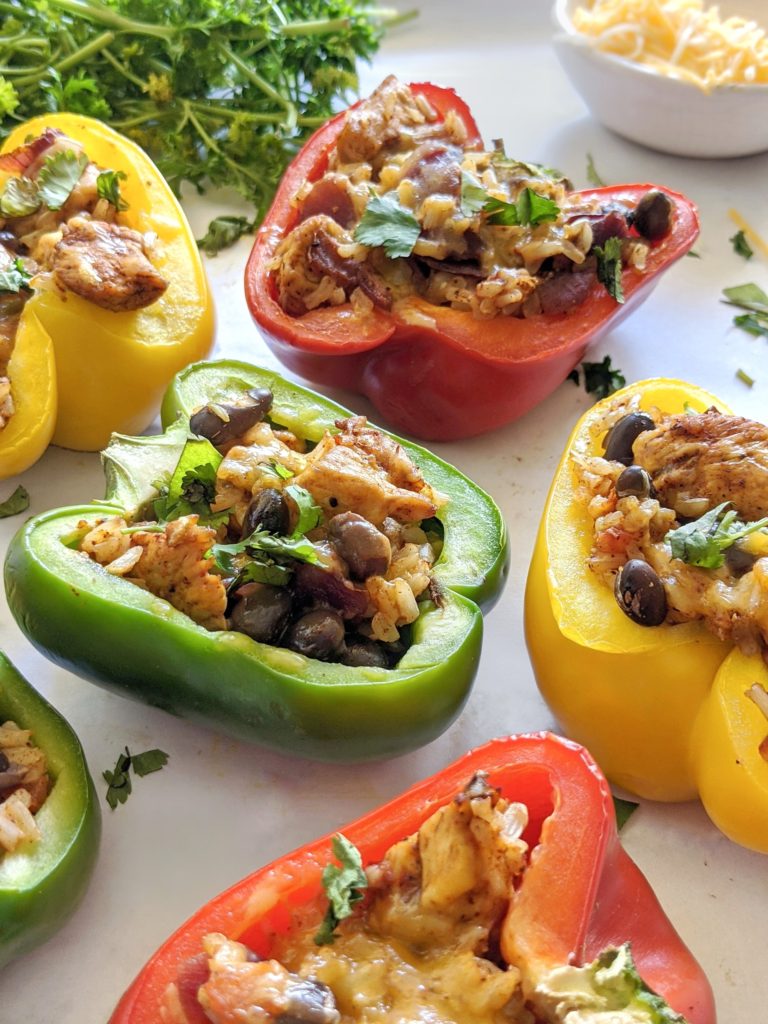 These delicious fajita meat stuffed bell peppers are topped with cheese and baked in the oven for a perfectly easy dinner!