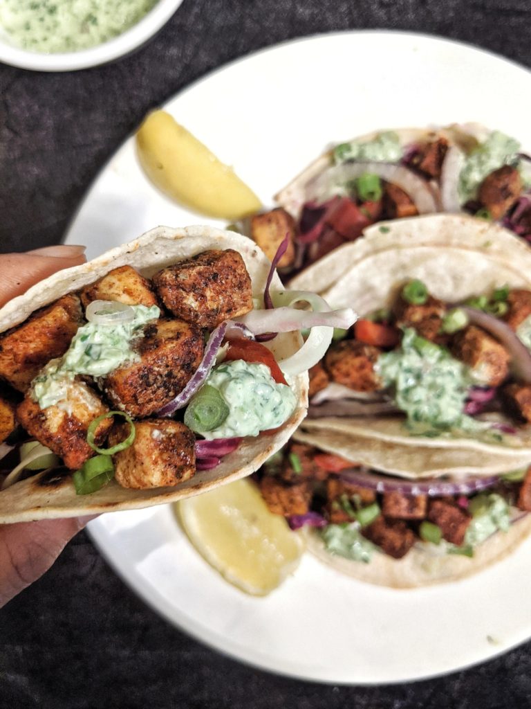 Spicy Crispy Tofu Tacos with Cilantro Lemon Slaw & Sauce. Easy vegan tacos topped with a creamy cilantro sauce that are loaded with protein, fiber and flavor. Perfect for your next Meatless Monday and Taco Tuesday!