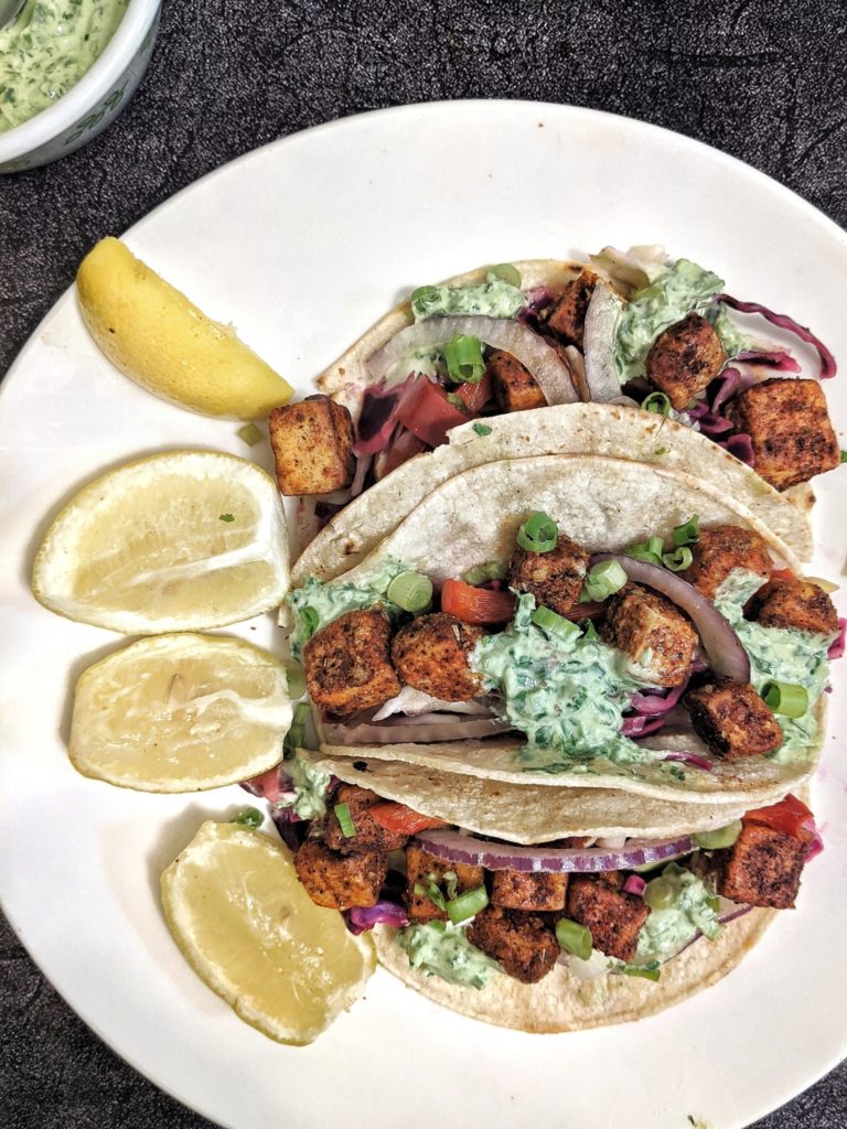 These spiced vegan tofu tacos are great for whenever you need a high protein, vegetarian, and gluten-free lunch - so pretty much any day of the week! Topped with a delicious vegan cilantro lemon cream sauce made with no sour cream and no dairy either!
