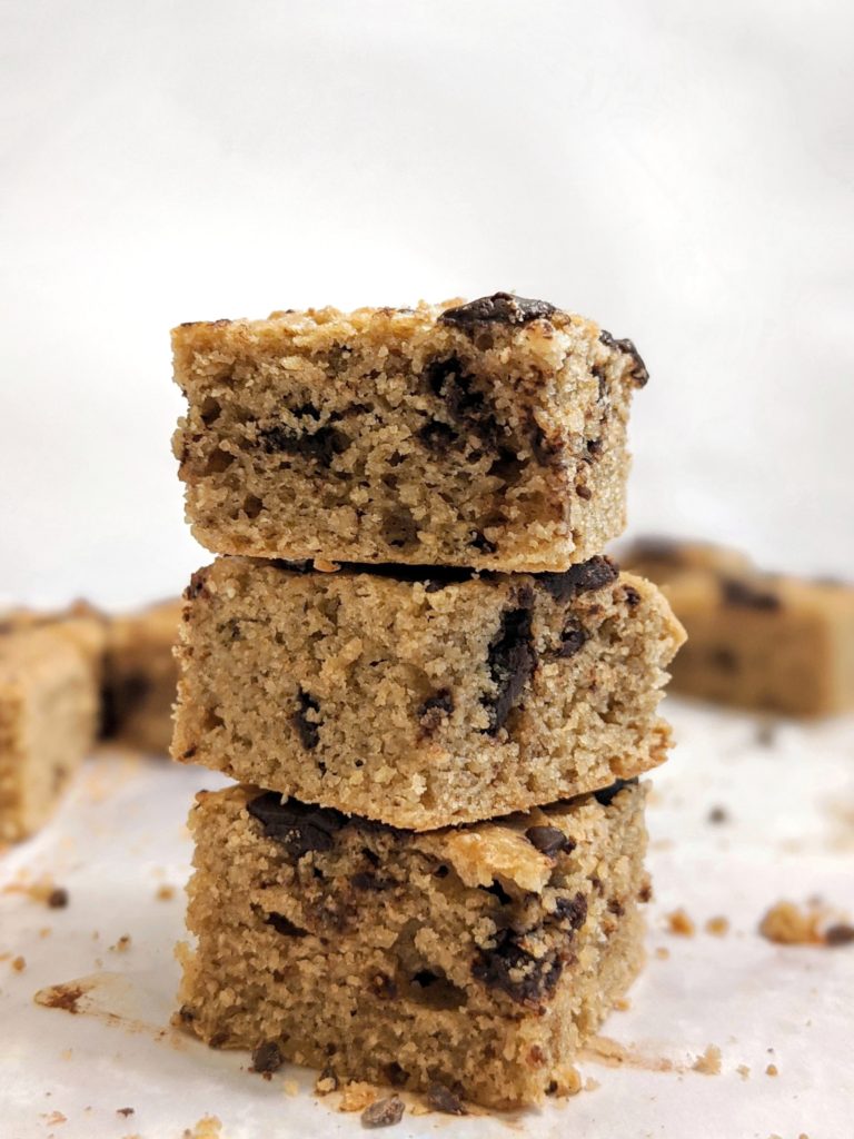 Delicious and moist Chocolate Chunk Tahini Cake Bars made with Cashew Flour are the perfect gluten-free snack or dessert; Rich tahini flavors balanced out by subtle cashew with chunks of dark chocolate. 