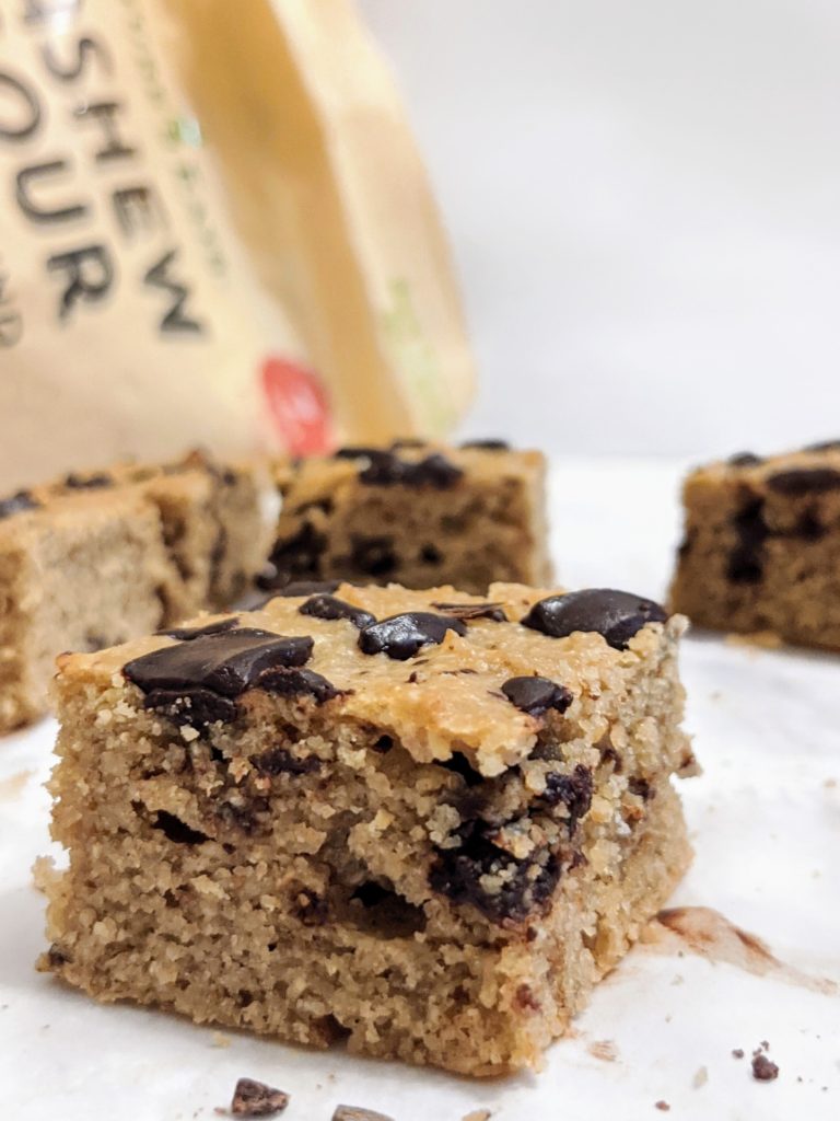 A healthy gluten free and grain free chocolate chip tahini cake made with no sugar, no eggs, no milk and no butter that can easily be turned into sugar free chocolate chunk tahini blondies too!
