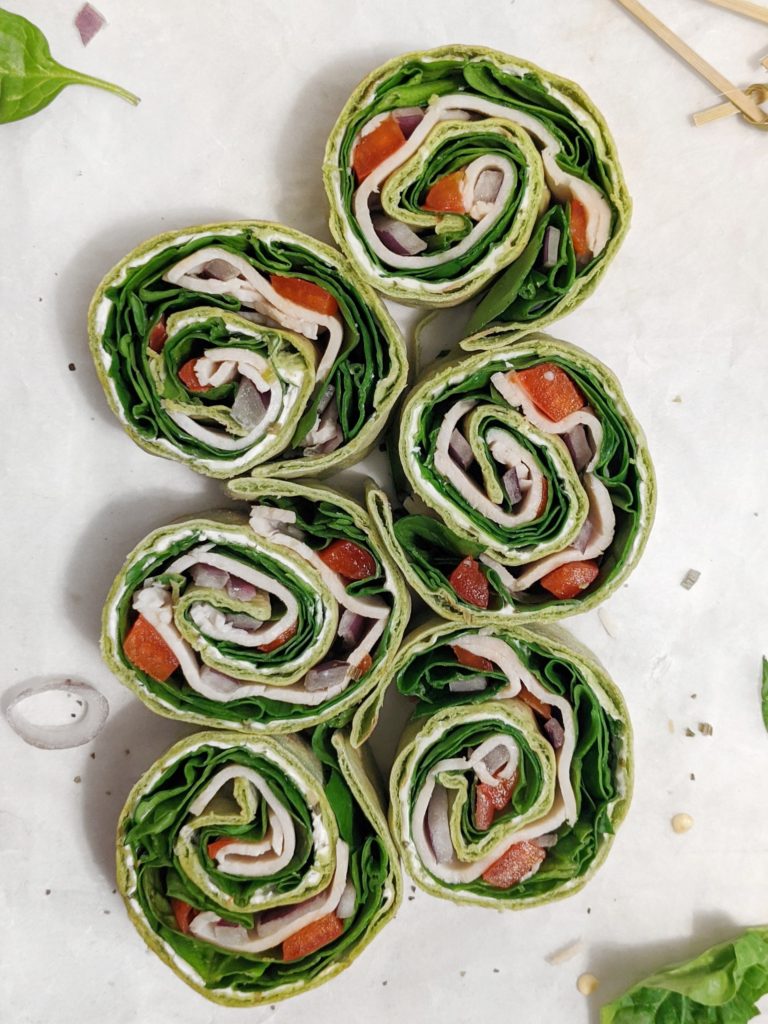 Quick and easy Turkey-Spinach wraps rolled up with flavored cream cheese and crunchy peppers and onions and sliced into pinwheels. A delicious meal-prep lunch or party appetizer that comes together in 5 minutes!