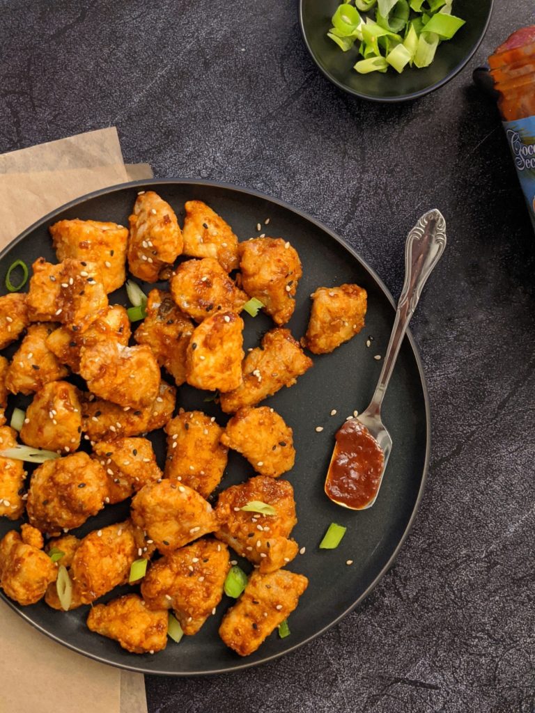 This paleo friendly korean fried chicken breast is coated with tapioca flour, cooked in the air fryer and tossed in a no soy spicy korean sauce made with coconut aminos and gochujang - a sweet and spicy appetizer that tastes like bbq wings!