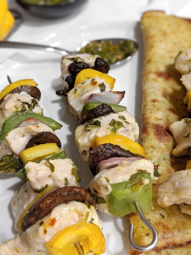 Argentinian chimichurri marinated chicken kabobs served with a low fat chimichurri sauce for an easy and healthy keto and low carb dinner.