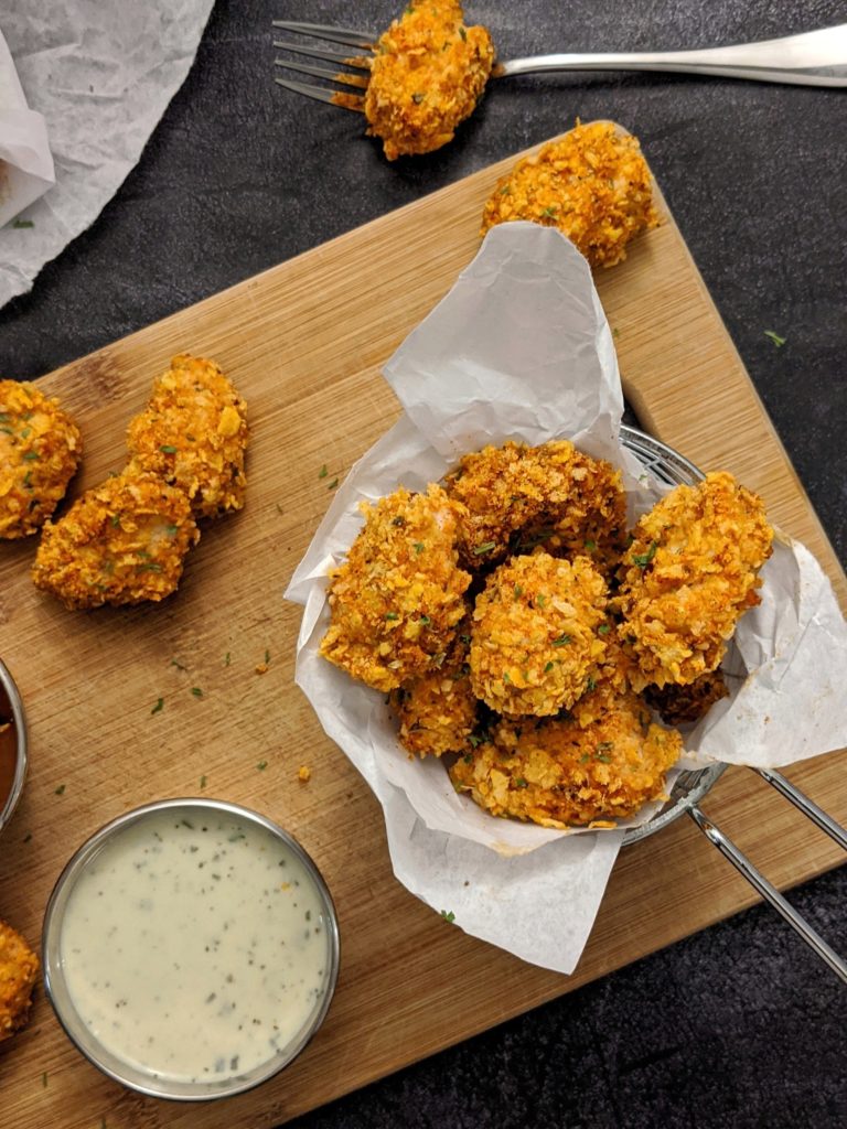 Hot and crispy, this Cornflake Crusted Cajun Popcorn Chicken is baked in the oven and so much better than the deep-fried KFC version. They’re delicious, crunchy and healthy and make a fun family dinner or party appetizer!