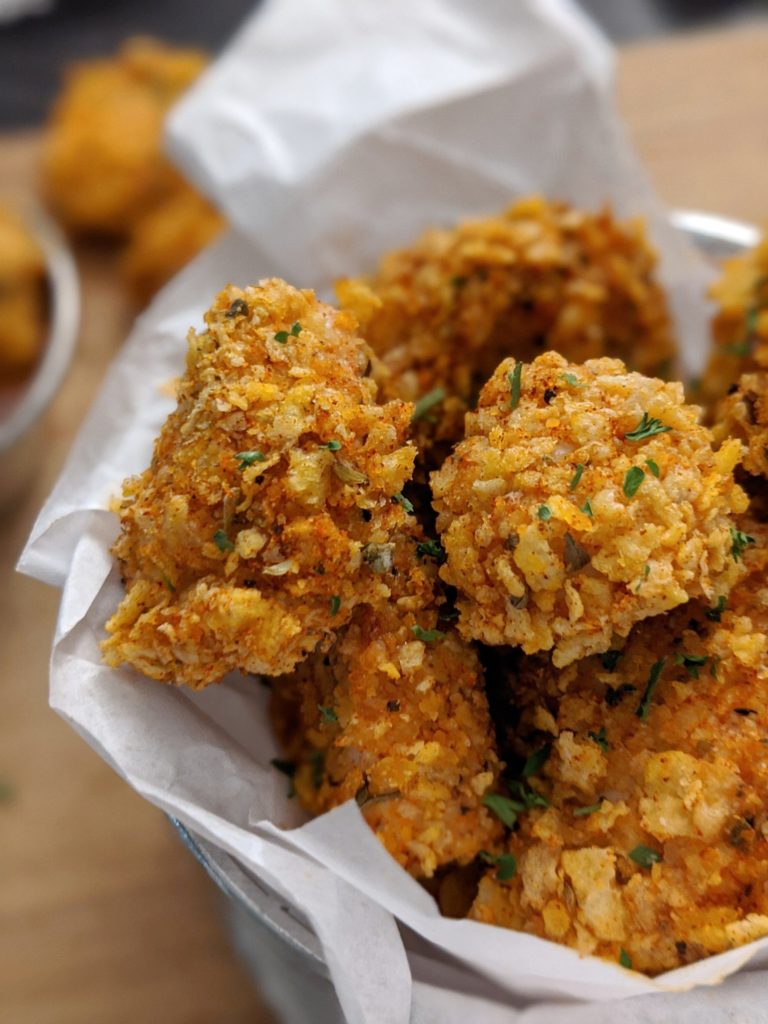 Bake or air fry these easy cornflake crusted cajun chicken popcorn bites for a healthy appetizer.