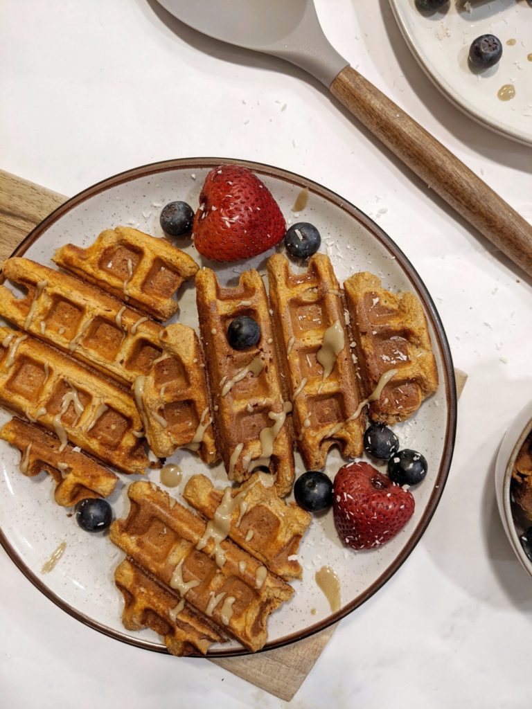 Soft and fluffy Sweet Potato Protein Waffles with a perfect crispy edge! These healthy waffles are made with mashed sweet potato, protein powder and whole wheat flour and full of warm spices - a delicious breakfast indeed!