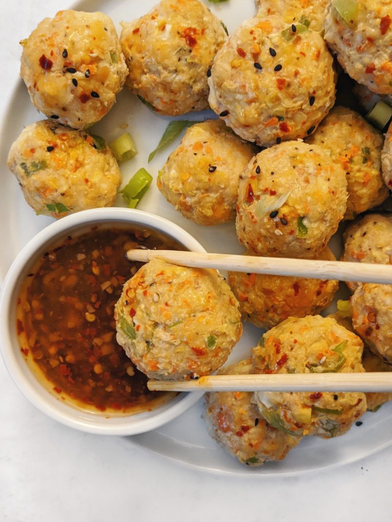 These Egg Roll Chicken Meatballs paired with a homemade Sweet Chili Sauce are made with coconut aminos for the perfect Paleo recipe. Juicy and crunchy just like the Asian appetizer, and sure to be a family favorite!