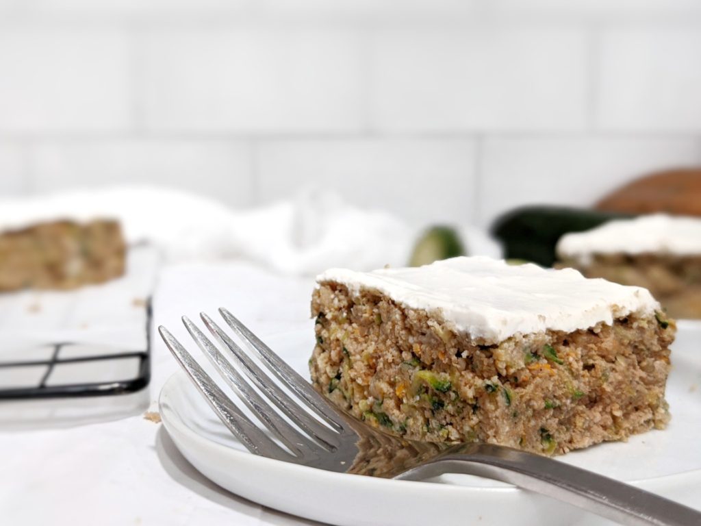 Make this fall themed spiced zucchini cake baked in a loaf pan but without the cream cheese frosting for a sugar free, paleo and vegan Thanksgiving dessert.