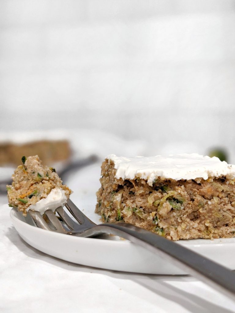 A warm Zucchini Cake spiced with cinnamon, nutmeg and ginger, and topped with a sweet Cream Cheese Frosting for the perfect Gluten-free Fall dessert.