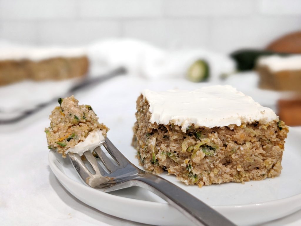An easy and healthy cinnamon spiced zucchini cake topped with a reduced fat cream cheese frosting that’s great for a dessert, breakfast or just for snacking on.