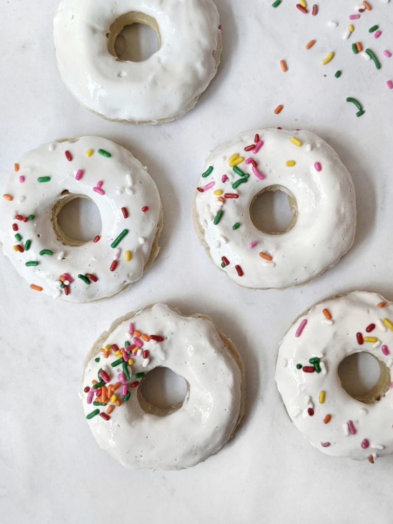 Soft and tender Gluten Free Vanilla Donuts that taste just like a freshly baked birthday cake! Simple ingredients, super easy, baked, and so delicious you’d never guess they’re sugar and dairy free too.