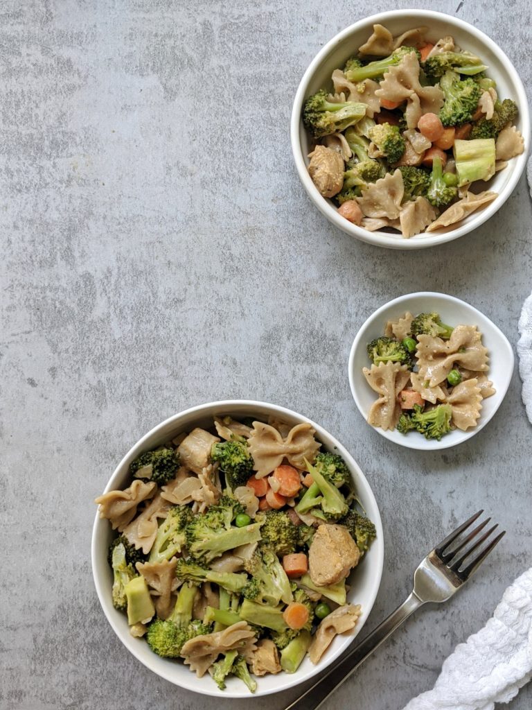 Creamy Cajun Chicken & Broccoli Pasta Salad with carrots, peas, and a sweet and spicy cajun-seasoned sauce. This delicious protein-packed pasta salad is ready in under 15 minutes and tastes great hot or cold!
