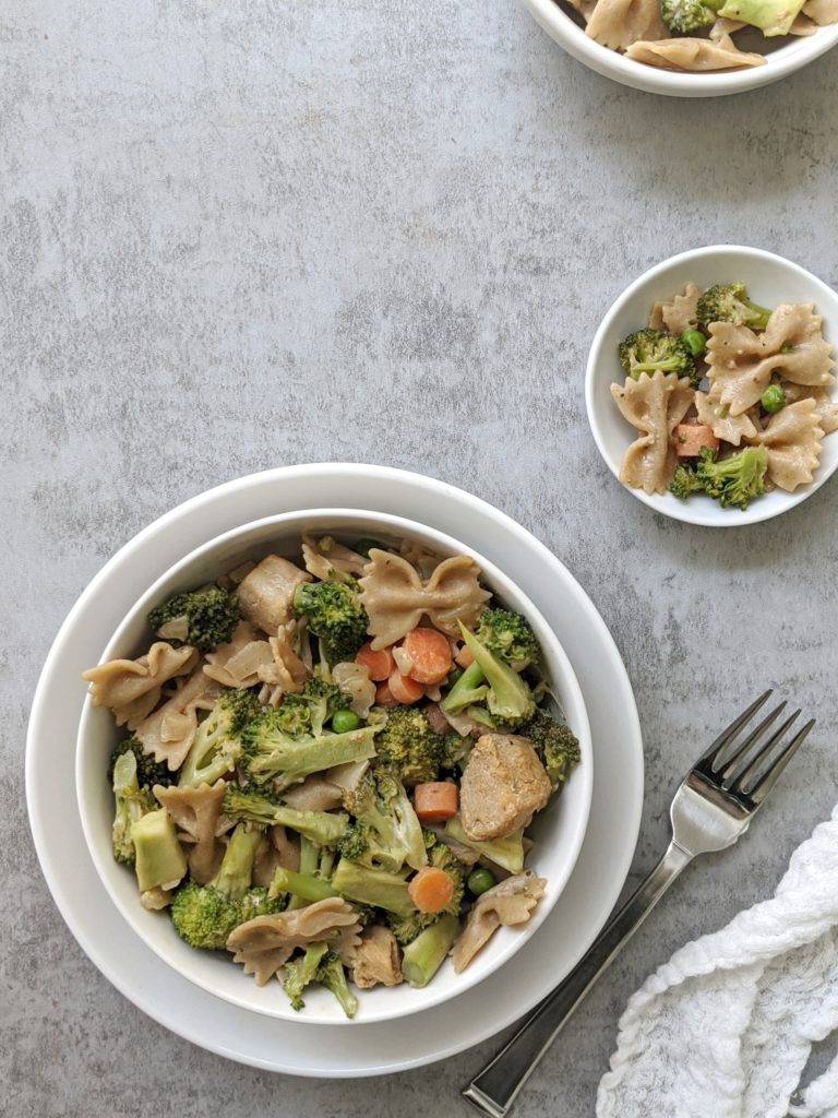 Creamy Cajun Chicken & Broccoli Pasta Salad with carrots, peas, and a sweet and spicy cajun-seasoned sauce. This delicious protein-packed pasta salad is ready in under 15 minutes and tastes great hot or cold!