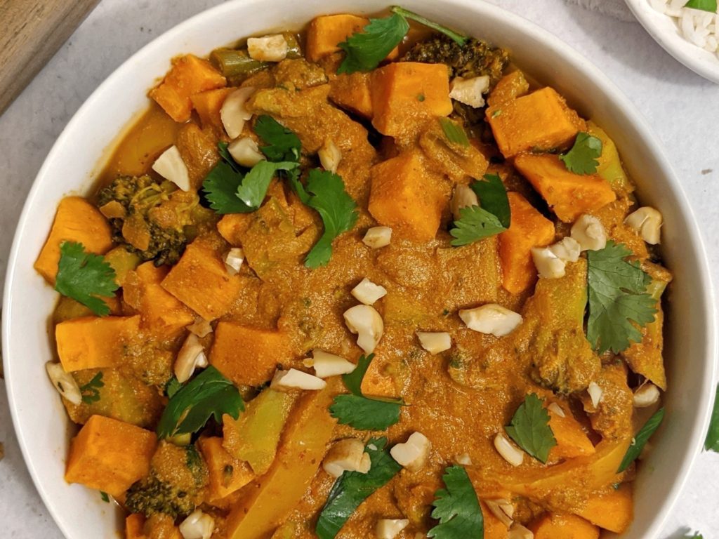 An easy Indian-inspired veggie-loaded vegan sweet potato and broccoli curry made without coconut milk, this recipe is a great low fat and low calorie weekly meal prep idea!