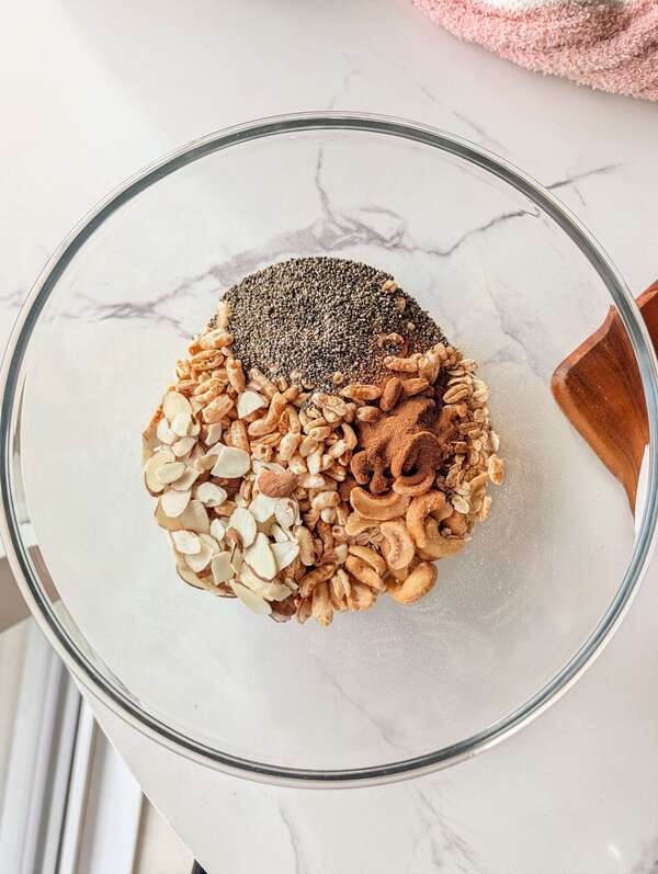The ultimate no-oil but still crunchy Egg White Granola recipe! A low-fat, low-sugar, and high-volume cereal hack made with egg whites for huge, satisfying clusters. dry mix