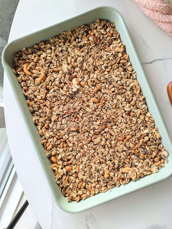Bake the ultimate no-oil but still crunchy Egg White Granola recipe! A low-fat, low-sugar, and high-volume cereal hack made with egg whites for huge, satisfying clusters.