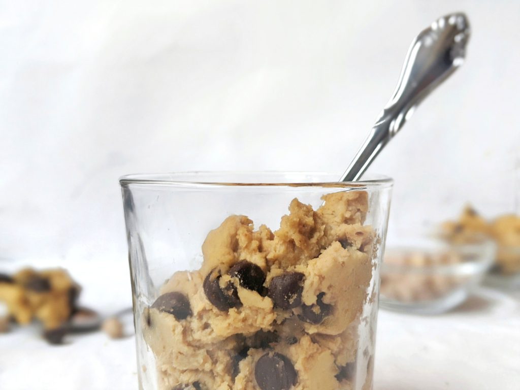 Roll or press down the raw edible chickpea cookie dough mixture from the food processor to make healthy balls or bars bars for a quick and easy no bake treat.