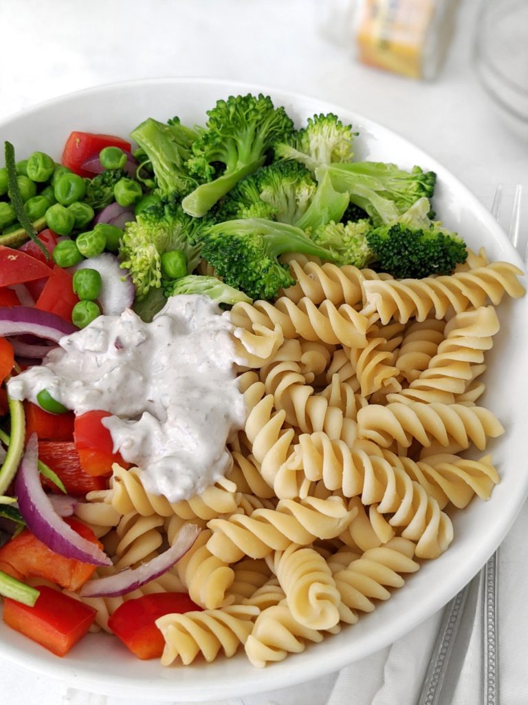 Gorgeous Vegan Pasta Salad packed with fresh broccoli, zucchini and peppers, tossed in a Creamy Nut Butter or Tahini Sauce. This easy vegetarian pasta salad is perfect for a meal prep lunch or summer potluck.