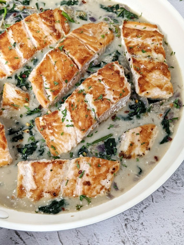 This slightly creamy spinach salmon is actually quite healthy because it uses light coconut milk and just a bit of shredded parmesan for the sauce.