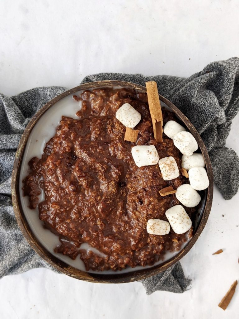 Creamy and Spicy Mexican Hot Chocolate Protein Oats made with cacao and chocolate protein powder, and a hint of cinnamon and cayenne pepper. A protein breakfast bowl with warm spices that tastes like the authentic Mexican chocolate drink!