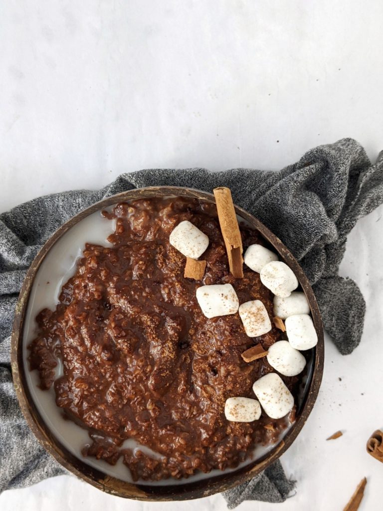 Creamy and Spicy Mexican Hot Chocolate Protein Oats made with cacao and chocolate protein powder, and a hint of cinnamon and cayenne pepper. A protein breakfast bowl with warm spices that tastes like the authentic Mexican chocolate drink!