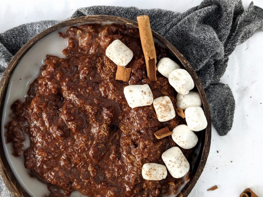 Creamy and Spicy Mexican Hot Chocolate Protein Oats made with cacao and chocolate protein powder, and a hint of cinnamon and cayenne pepper. A protein breakfast bowl with warm spices that tastes like the authentic Mexican chocolate drink!