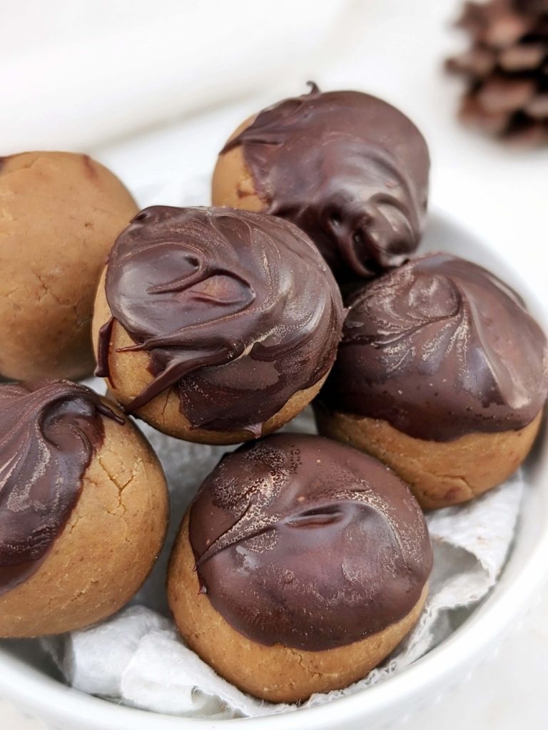 Double Peanut Butter Protein Truffles made with the nut butter and powdered peanut butter. Dip them in some melted chocolate and make high protein buckeye balls! A pretty perfect snack, dessert, or post workout treat!