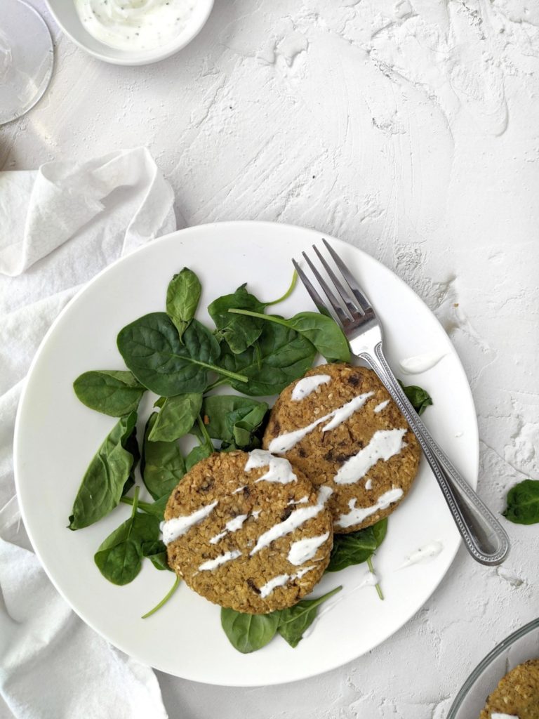 Healthy Baked Mushroom Lentil Patties paired with a zesty Tzatziki sauce - A delicious, protein-packed Vegan recipe. Bound together with oats, these patties are gluten-free, and are perfect for an appetizer, or even a veggie burger!