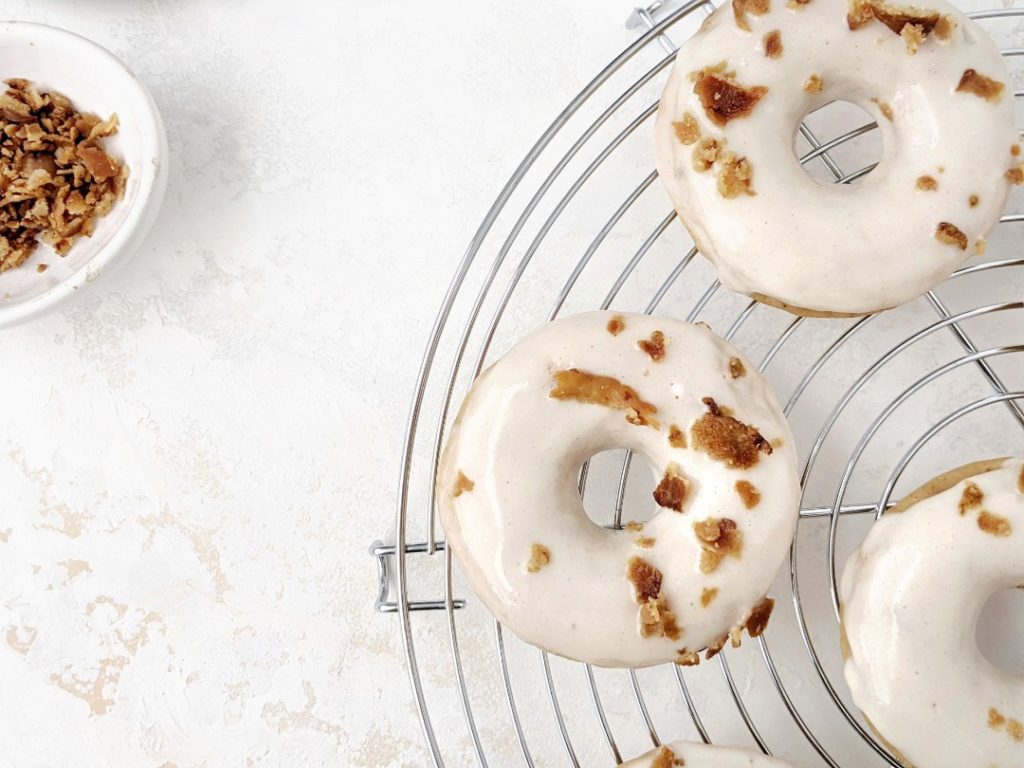 I actually call these double maple bacon protein donuts, because they have bacon pieces not only on the maple glaze, but also inside the baked donut itself! It’s also a double layered glaze, and has protein powder in the donuts and in the glaze too!