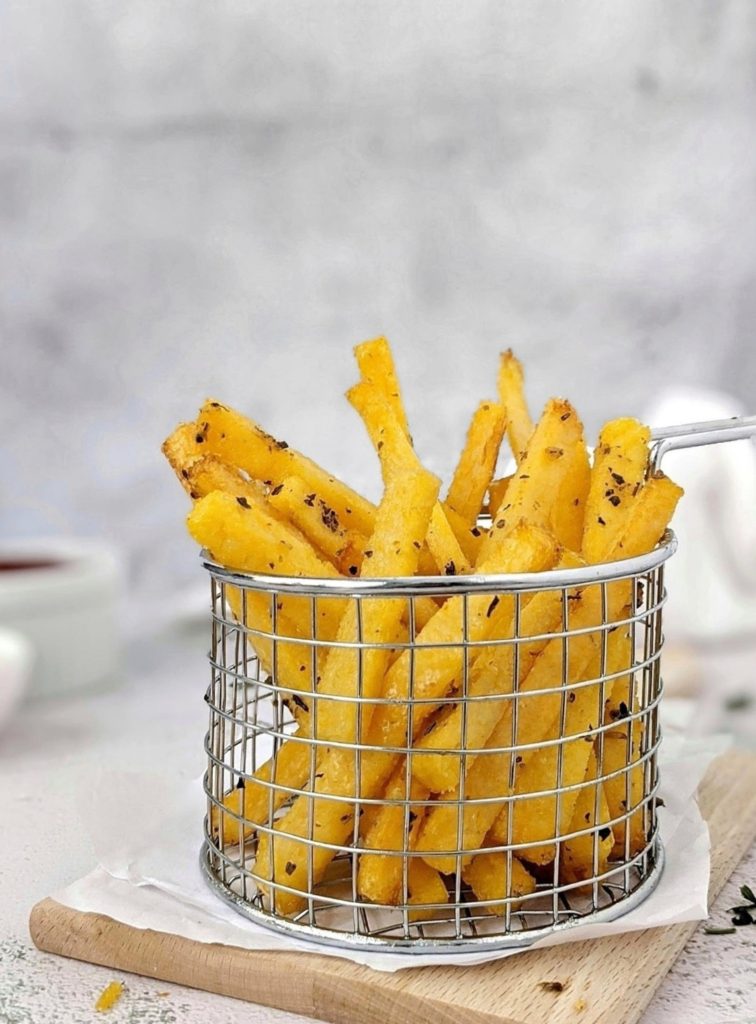 Crispy Garlic & Herb Baked Polenta Fries made with precooked packaged polenta and tossed in a bit of herby garlicky melted butter. An easy, healthy and delicious party appetizer or side dish that’s gluten-free too!