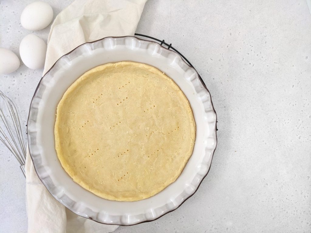 Light and buttery, this Coconut Flour Pie Crust is the perfect base for a keto or low carb pie or quiche recipe. Made with just coconut flour, eggs, butter and salt, it really is easy as pie!