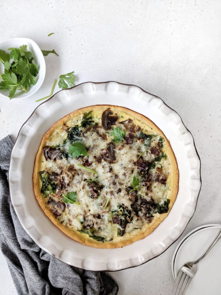 Delicious Mushroom and Kale Quiche baked in a Coconut Flour Crust; An easy low carb quiche perfect for a keto brunch or freezer-friendly meal prep breakfast. Great for a gluten-free option too!