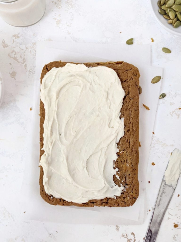 Healthy Oil-free Protein Pumpkin Cake made with whole wheat flour and protein powder, and topped with a protein cream cheese frosting. An easy and delicious snack cake perfect for a thanksgiving dessert or even post workout treat!