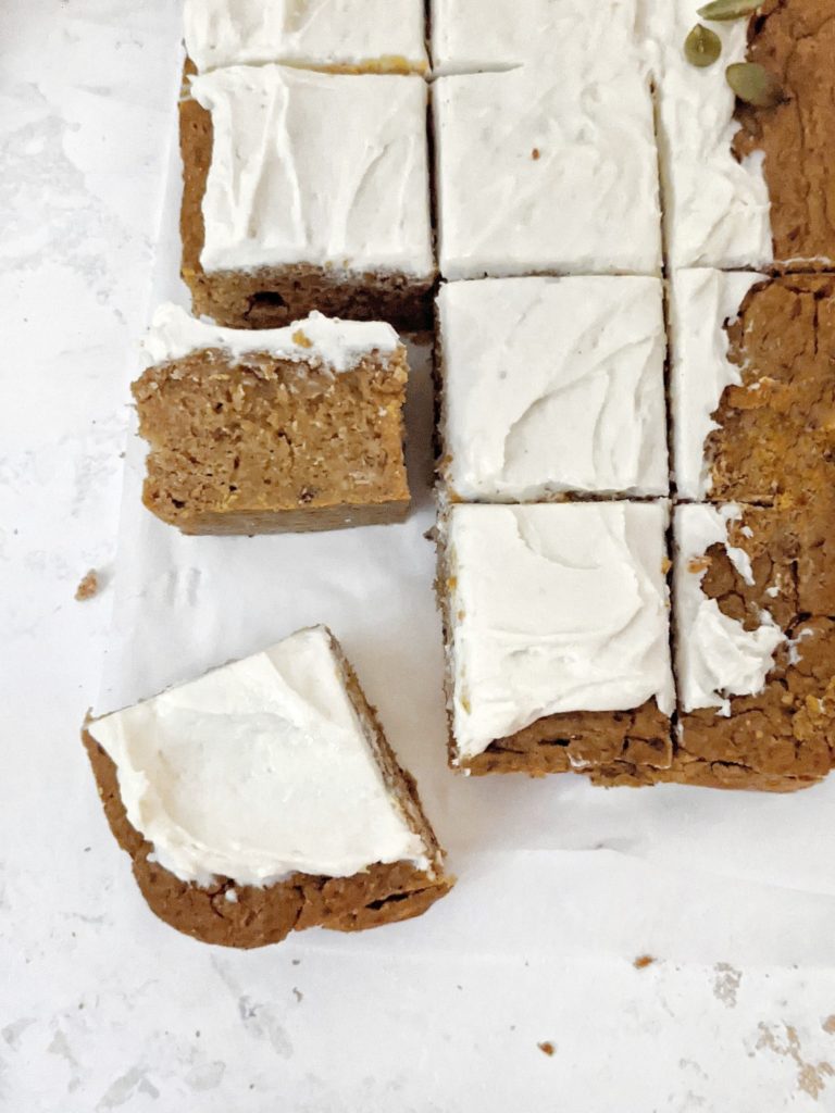 Healthy Oil-free Protein Pumpkin Cake made with whole wheat flour and protein powder, and topped with a protein cream cheese frosting. An easy and delicious snack cake perfect for a thanksgiving dessert or even post workout treat!