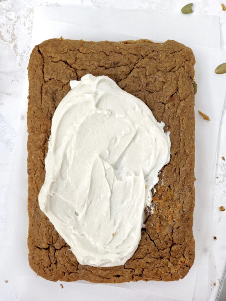Healthy Oil-free Protein Pumpkin Cake made with whole wheat flour and protein powder, and topped with a protein cream cheese frosting. An easy and delicious snack cake perfect for a thanksgiving dessert or even post workout treat!