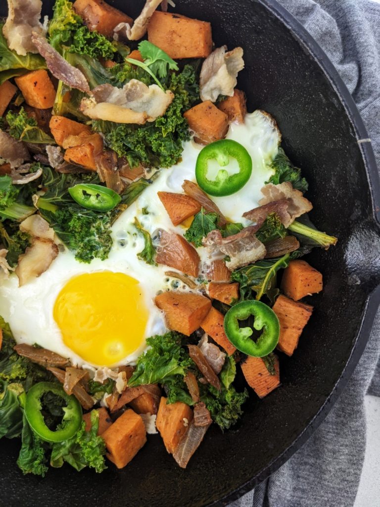 This Sweet Potato Kale and Bacon Hash is the perfect single serve Fall brunch recipe! Seasoned tender vegetables, salty crispy bacon and a well fried egg - an easy, cozy breakfast for one.