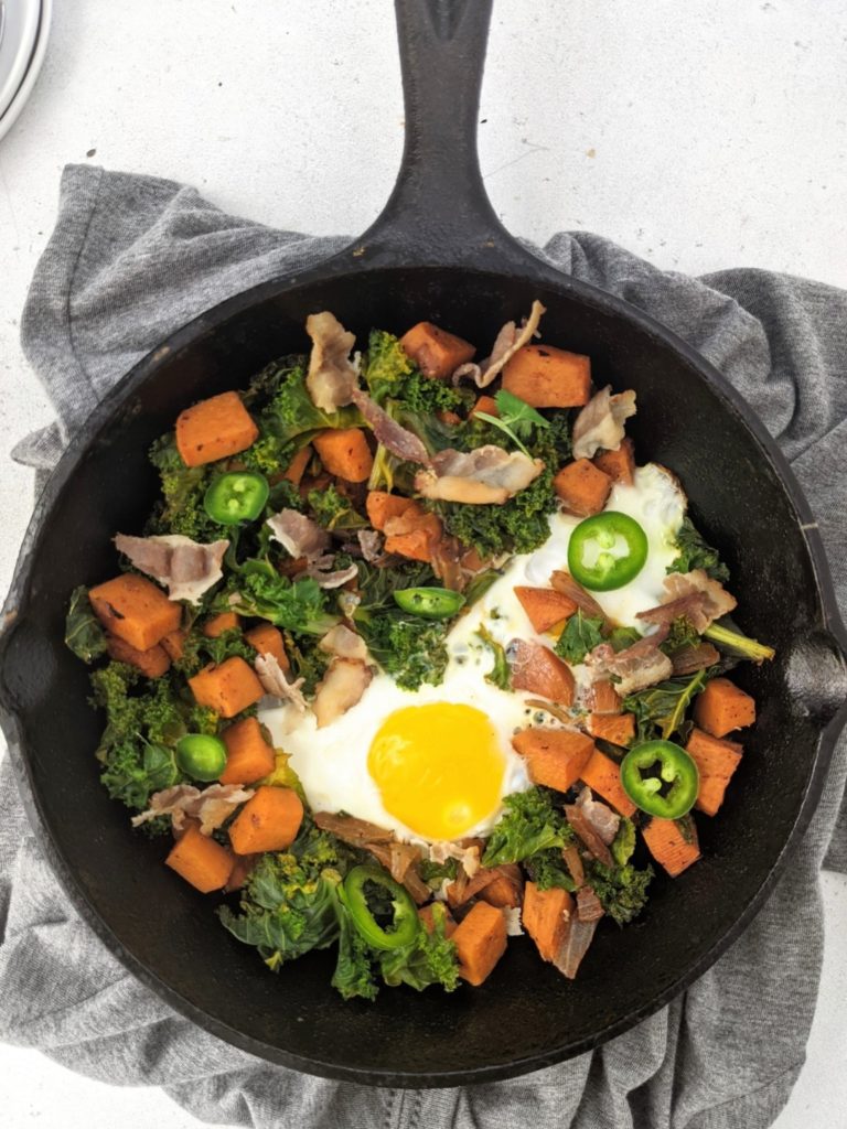 This Sweet Potato Kale and Bacon Hash is the perfect single serve Fall brunch recipe! Seasoned tender vegetables, salty crispy bacon and a well fried egg - an easy, cozy breakfast for one.