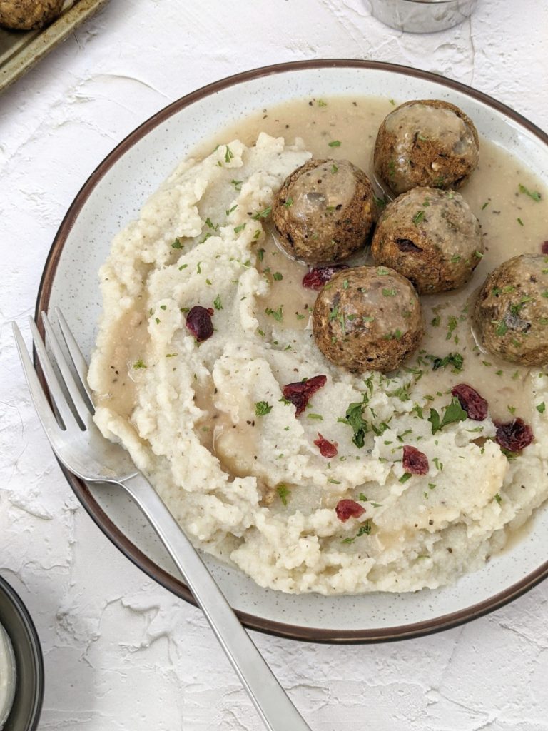 Flavor-packed Vegan Swedish Meatballs made with lentils and mushrooms, and topped with a coconut milk sauce. Served with mashed cauliflower, it’s an easy, healthy and delicious recipe perfect for Meatless Monday or even a meal prep lunch.