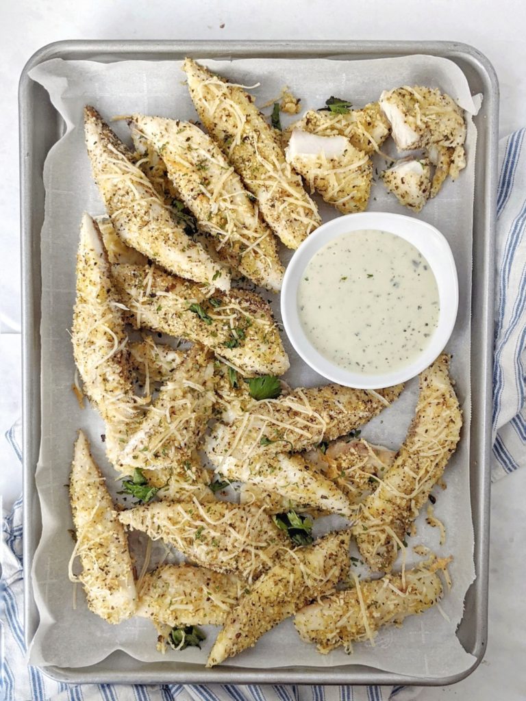 Perfectly flaky and flavorful Baked Garlic Parmesan Fish Sticks for a healthy dinner in under 30 minutes. These parmesan crusted fish sticks have an almond flour coating and also make for an easy keto, low carb and gluten free party appetizer!