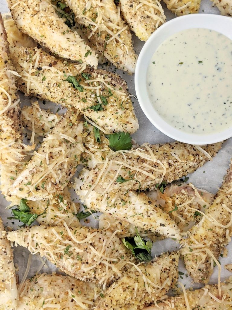 Perfectly flaky and flavorful Baked Garlic Parmesan Fish Sticks for a healthy dinner in under 30 minutes. These parmesan crusted fish sticks have an almond flour coating and also make for an easy keto, low carb and gluten free party appetizer!