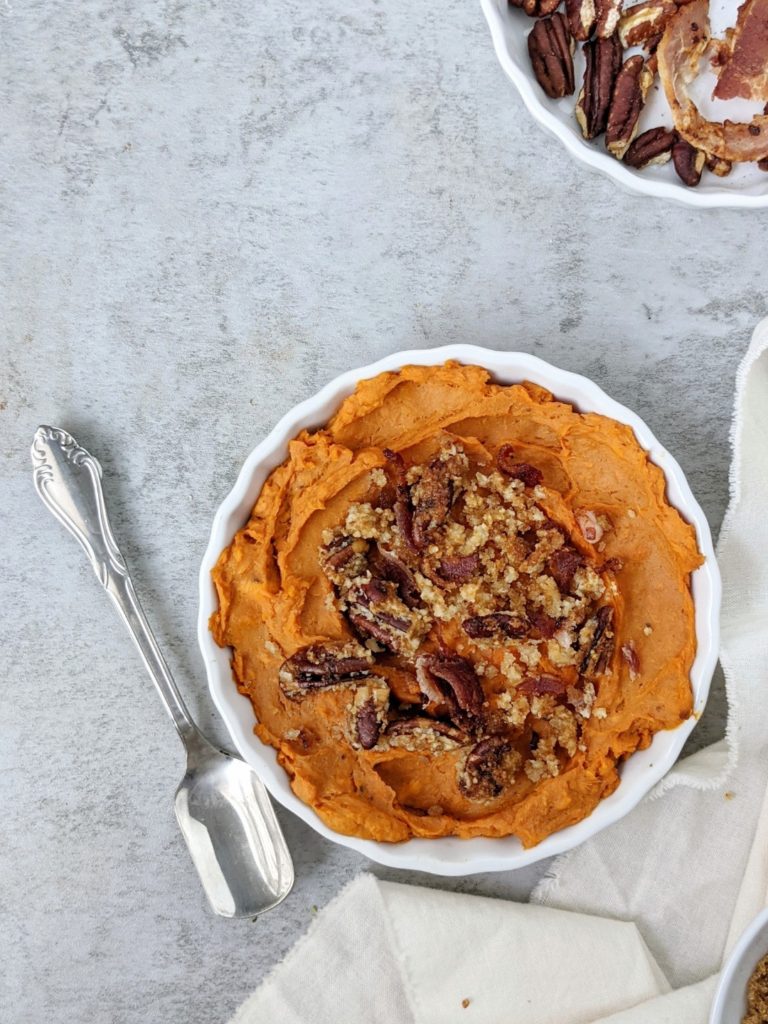 A delicious Sweet Potato Casserole for One topped with a brown sugar Bacon Pecan Streusel. This easy sweet and savory mini sweet potato casserole is made in a ramekin and is great for a single serve or small batch Thanksgiving dessert.