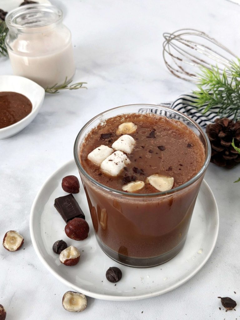 This Nutella Hot Chocolate recipe uses cacao powder, homemade sugar free Nutella and is sweetened with stevia - definitely the ultimate no-guilt hot cocoa! An easy hot chocolate hazelnut drink to use up leftover Nutella and can be made in the microwave. Vegan and dairy free too!