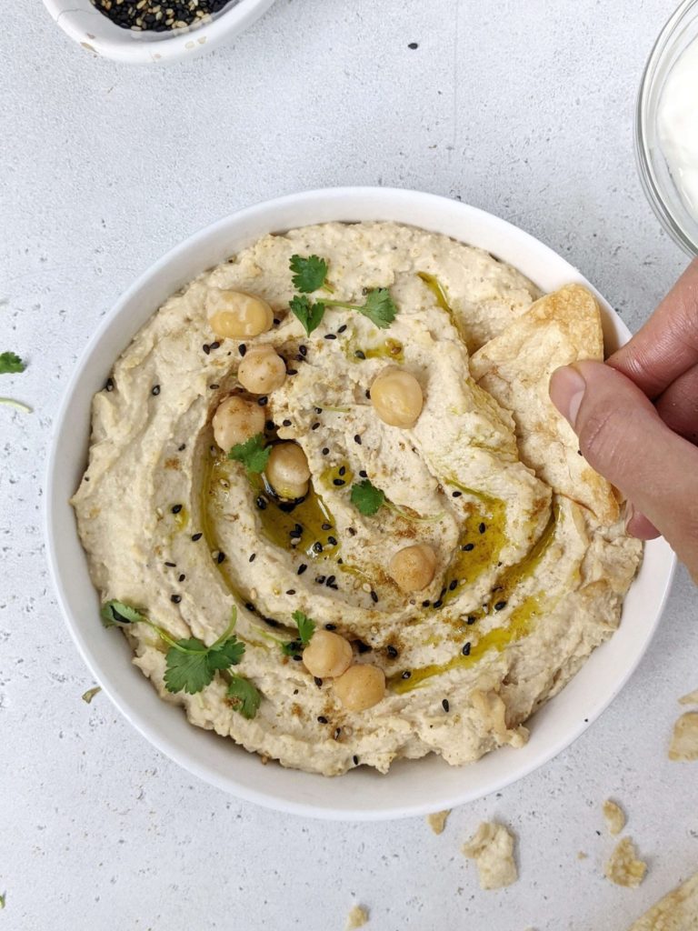 This recipe makes the Best Healthy Hummus with Greek Yogurt and Tahini, but no oil. A homemade high protein hummus that’s skinny, easy and delicious too! 