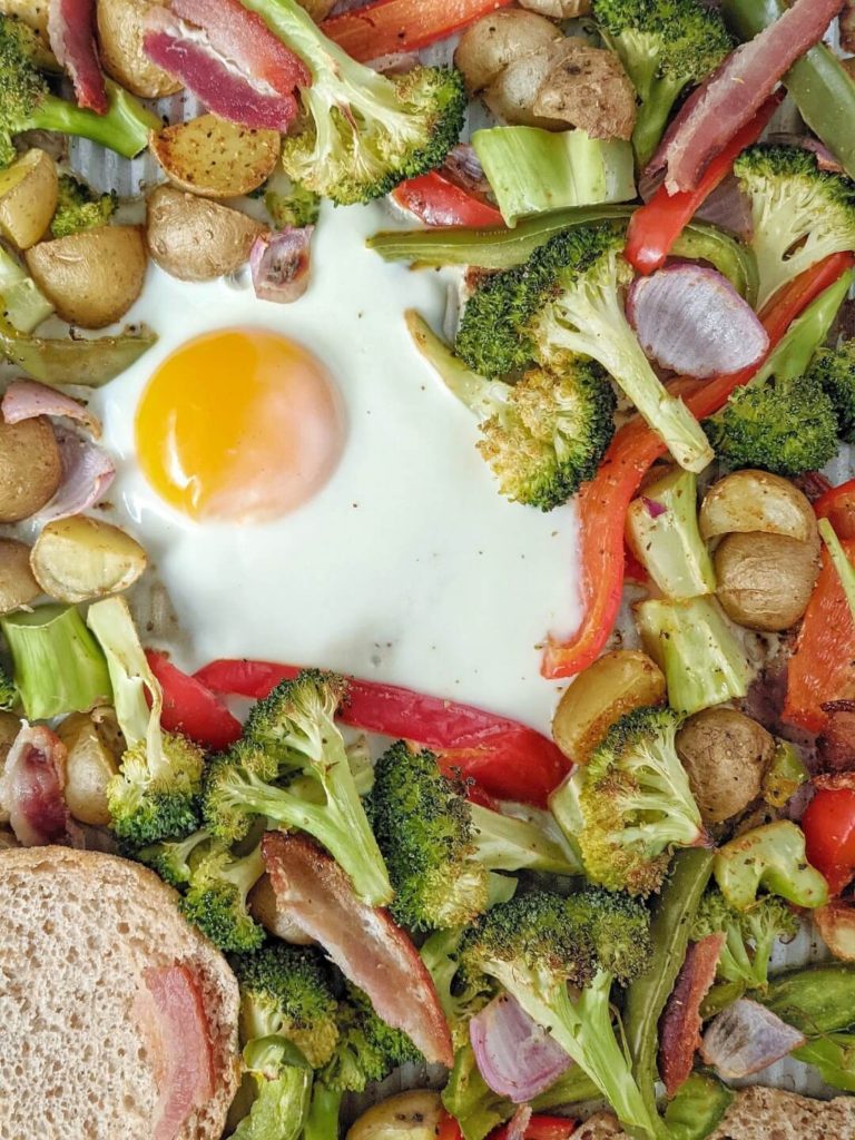 A delicious and easy Sheet Pan Breakfast for One complete with roasted vegetables, potatoes, bacon, eggs and an English Muffin all baked in one pan! A perfect healthy one pan breakfast bake for a fancy individual brunch too.