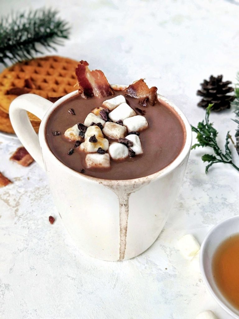 An extremely easy Maple Hot Chocolate made with just 3 ingredients and topped with bacon for a bit of sweet-n-salty! This healthy bacon hot chocolate uses almond milk and sugar-free maple syrup, so can easily be made Vegan too!