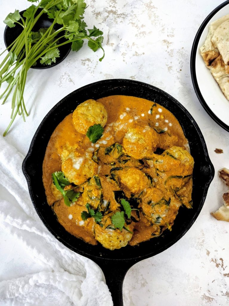 Perfectly flavorful yet Healthy Indian Chicken Meatballs Curry! This Chicken Kofta Curry has baked gluten free chicken meatballs in an aromatic coconut milk curry sauce. A great Paleo friendly dinner recipe!