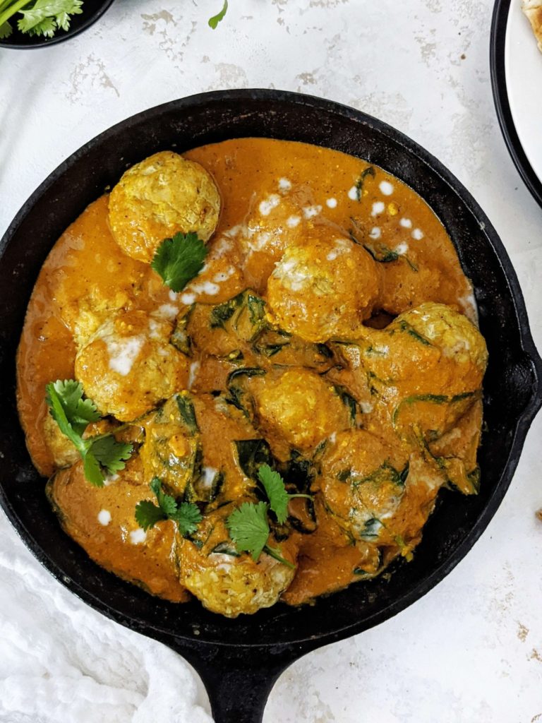 Perfectly flavorful yet Healthy Indian Chicken Meatballs Curry! This Chicken Kofta Curry has baked gluten free chicken meatballs in an aromatic coconut milk curry sauce. A great Paleo friendly dinner recipe!