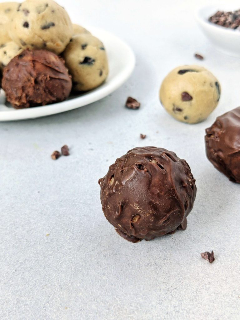 Easy and healthy Low Carb Cookie Dough Protein Balls made with cashew butter, vanilla protein powder, and studded with cacao nibs! No bake cookie dough protein bites are perfect for a Keto, Vegan and Gluten free snack, high protein dessert or energy boost.