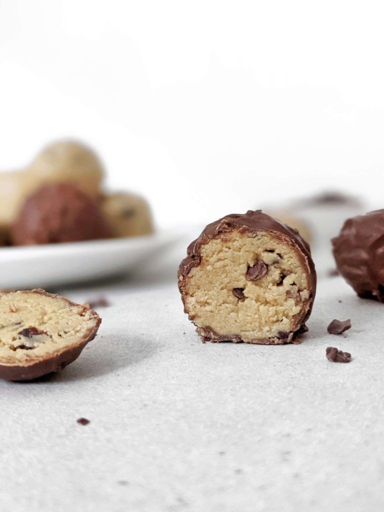 Easy and healthy Low Carb Cookie Dough Protein Balls made with cashew butter, vanilla protein powder, and studded with cacao nibs! No bake cookie dough protein bites are perfect for a Keto, Vegan and Gluten free snack, high protein dessert or energy boost.